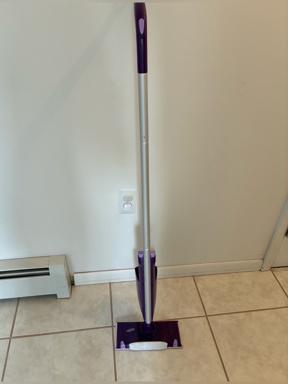 Swiffer Wet Jet Spray Mop with comfortable handle and scrubber pad